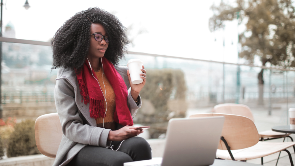 Woman working outdoors on a laptop